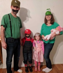 It's Mario Time! The family went as Luigi, Mario, Princess Peach, Yoshi and Toadstool